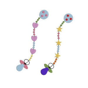 May include: Two baby pacifiers with colorful beads and charms. One pacifier is blue with pink hearts and a blue circle with red dots. The other pacifier is purple with green stars and a red circle with red dots.