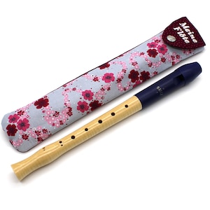 May include: A wooden recorder with a blue and black mouthpiece and a floral patterned case. The case has a red flap with the text "Meine Flöte" embroidered on it.