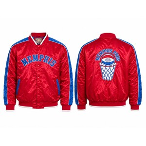 May include: A red satin bomber jacket with blue side stripes and white trim. The front features the word MEMPHIS in blue lettering. The back displays a basketball graphic above a net with the text MEMPHIS PROS and ABA on the basketball.
