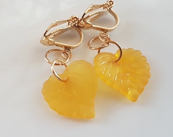 Children's ear clips light gold with orange leaves