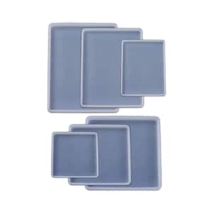 May include: Set of six square silicone molds in various sizes. The molds are white and have a smooth, glossy finish.