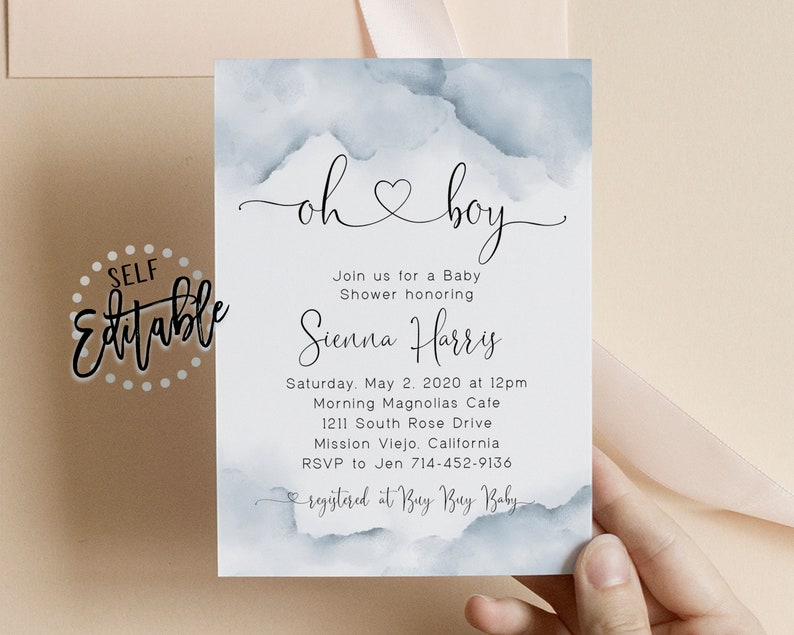 May include: A baby shower invitation with a watercolor background in shades of blue. The invitation reads "oh boy" with a heart symbol and includes the name Sienna Harris, the date and time of the shower, the location, and the RSVP information. The invitation also includes the text "registered at Buy Buy Baby".