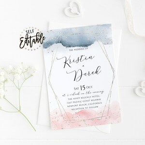May include: A wedding invitation with a watercolor background in shades of blue and pink with gold glitter accents. The invitation features a geometric frame with the names "Kristin + Derek" and the wedding date "Sat 15 Oct". The text reads "Join us to celebrate the wedding of Kristin + Derek Sat 15 Oct at 5 o'clock in the evening The Hyatt Regency Hotel 5427 Pacific Coast Highway Newport Beach, California Reception to follow"