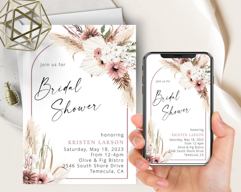 May include: A white bridal shower invitation with a pink and white floral design. The invitation reads "Join us for Bridal Shower honoring Kristen Larson Saturday, May 18, 2023 from 12-4pm Olive & Fig Bistro 3546 South Shore Drive Temecula, CA"