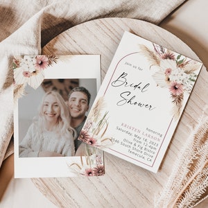 May include: A bridal shower invitation with a floral design featuring pampas grass and pink flowers. The invitation includes the text "Join us for Bridal Shower honoring Kristen Larson Saturday, May 18, 2023 from 12-4pm Olive & Fig Bistro 3546 South Shore Drive Temecula, CA"