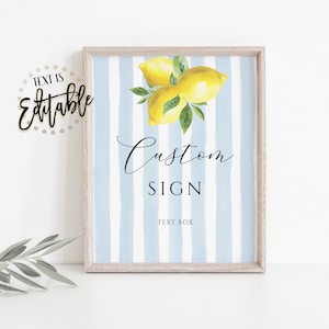 May include: A printable sign with a blue and white striped background and a watercolor illustration of lemons. The text on the sign reads "Custom Sign" and "Text Box".