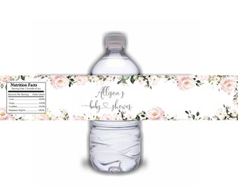 Könnte beinhalten: Wasserflaschenetikett mit floralem Design und dem Text "Allison's baby shower". Das Etikett enthält auch einen Nährwertangaben-Abschnitt mit Elementen wie Liebe, Umarmungen, Kuscheln und schlaflose Nächte.