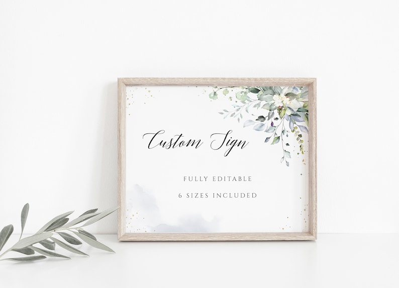 May include: A printable sign with the text "Custom Sign" in a cursive font. The sign is decorated with a watercolor floral design in shades of green and blue. The text "Fully Editable" and "6 Sizes Included" is also included on the sign.