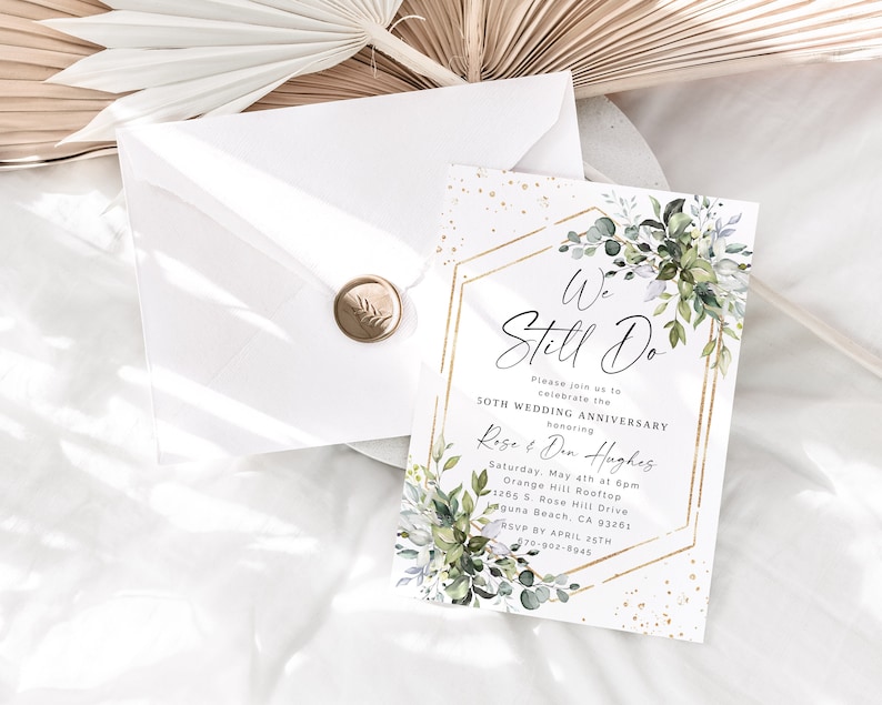 May include: A gold and white wedding anniversary invitation with green foliage and gold glitter. The invitation reads "We Still Do" and includes the couple's names, date, time, and location. RSVP by April 25th.