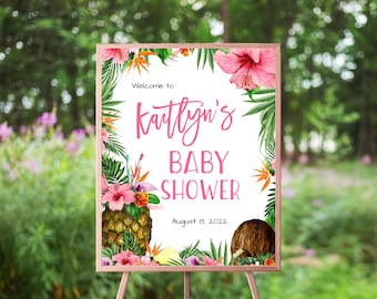 Könnte beinhalten: Ein tropisches Babyparty-Schild mit weißem Hintergrund und grünen und pinkfarbenen floralen Akzenten. Das Schild lautet "Willkommen zur Babyparty von Kaitlyn am 8. August 2022".