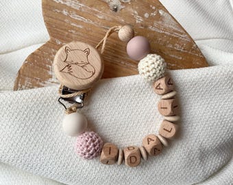 Personalized pacifier chain for girls and boys in many colors as a gift for a newborn.