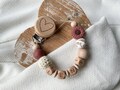 Pacifier chain with name for girls with flower in dark pink and white as a gift for birth product logo