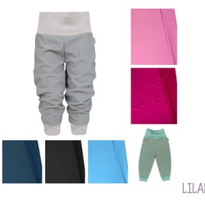 May include: Grey sweatpants with a grey waistband and a light grey fabric panel on the back. The sweatpants are shown with a variety of fabric swatches in pink, red, blue, teal, and black.