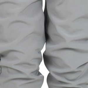 May include: A pair of gray sweatpants with a slightly wrinkled texture.