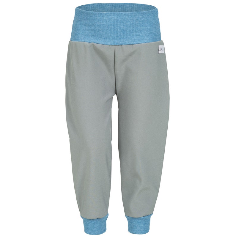 May include: Gray pants with a blue waistband and blue cuffs. The pants have a relaxed fit and are made of a soft, comfortable fabric.