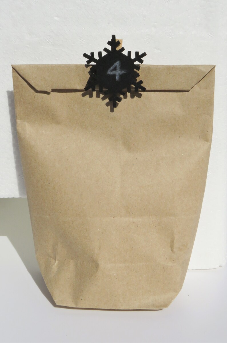 24 staples with black wooden snowflake for hanging advent calendar bags Advent calendar