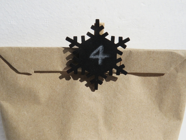 24 staples with black wooden snowflake for hanging advent calendar bags Advent calendar