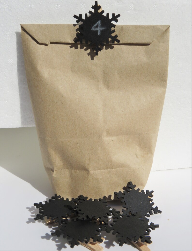 24 staples with black wooden snowflake for hanging advent calendar bags Advent calendar