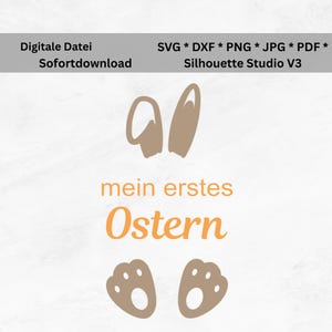 Könnte beinhalten: Ein digitales Design für Ostern, mit Hasenohren, Pfotenabdrücken und dem Text "mein erstes Ostern" in Orange und Braun. Das Design enthält die Dateiformate SVG, DXF, PNG, JPG und PDF, geeignet für Silhouette Studio V3.