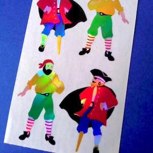 May include: Four colorful pirate stickers on a white background. The pirates wear red coats, black hats, and blue pants. Two pirates have black capes. The pirates have yellow skin and are in various poses.