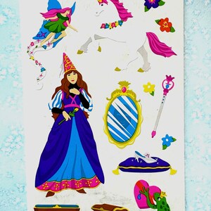 May include: A sticker sheet featuring a fairy with blue wings, a white unicorn with a pink mane, a person in a blue and purple gown with a pointed hat, a gold-framed mirror, a magic wand, a glass slipper on a pillow, a treasure chest, and a frog.