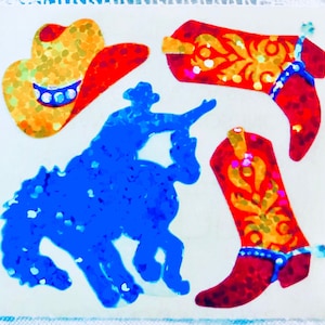 May include: A set of four colorful, glittery stickers featuring a cowboy riding a bucking horse, a cowboy hat, and two cowboy boots. The stickers are perfect for adding a touch of Western flair to any project.