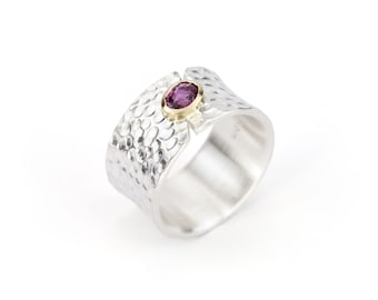wide silver ring with ruby set in 18k gold