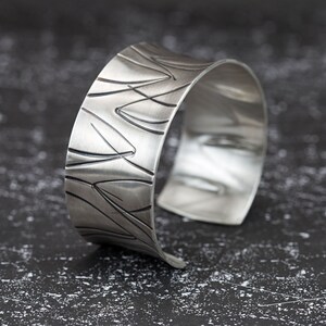 wide heavy silver bangle with pattern image 5