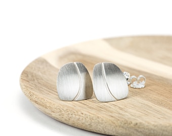 Silver studs with embossed line
