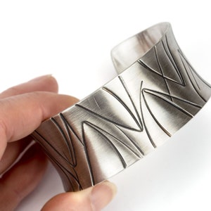 wide heavy silver bangle with pattern image 7