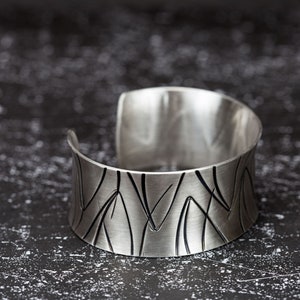 wide heavy silver bangle with pattern image 6