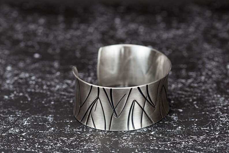 wide heavy silver bangle with pattern image 6