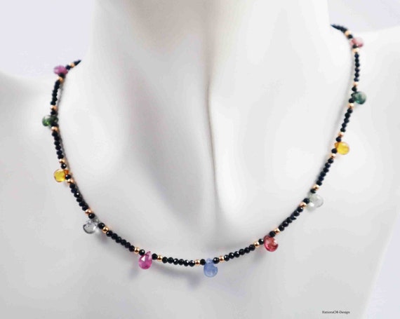 Sapphire necklace with multicolor sapphire brilets and intermediate parts made of 14 carat rose gold (585, solid)