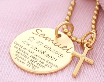 May include: A gold-colored pendant necklace with a round charm and a small cross. The charm is engraved with the name "Samuel", dates, a star, a fish symbol, and text from Psalm 91:11. The necklace has a ball chain.