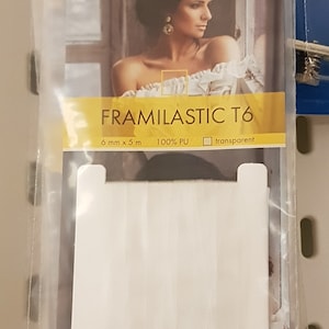Könnte beinhalten: Weißer elastischer Besatz mit dem Text "FRAMILASTIC T6" und den Details "6 mm x 5 m, 100% PU, transparent".