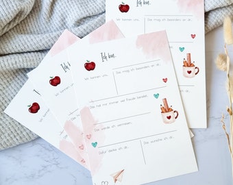 May include: Four printable cards with a pink watercolor background and a red apple illustration. The cards have the text "Ich bin..." and prompts for writing about what you like, what you miss, and what you are thankful for.