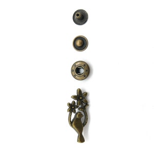 5 pieces, dove metal snap fasteners, old brass coloured/antique brass