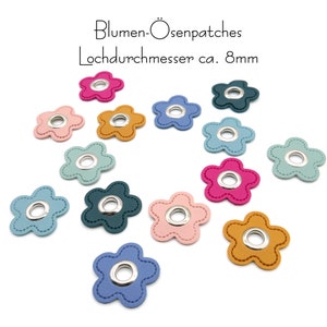 Peut inclure: Assortiment de 12 patchs de fleurs en feutre de couleurs vives avec un œillet argenté au centre. Chaque fleur a 5 pétales et mesure environ 8 mm de diamètre.  "Blumen-Ösenpatches Lochdurchmesser ca. 8mm" est écrit en noir en haut de l'image.