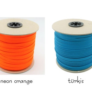 May include: Two spools of elastic cord, one neon orange and one turquoise.