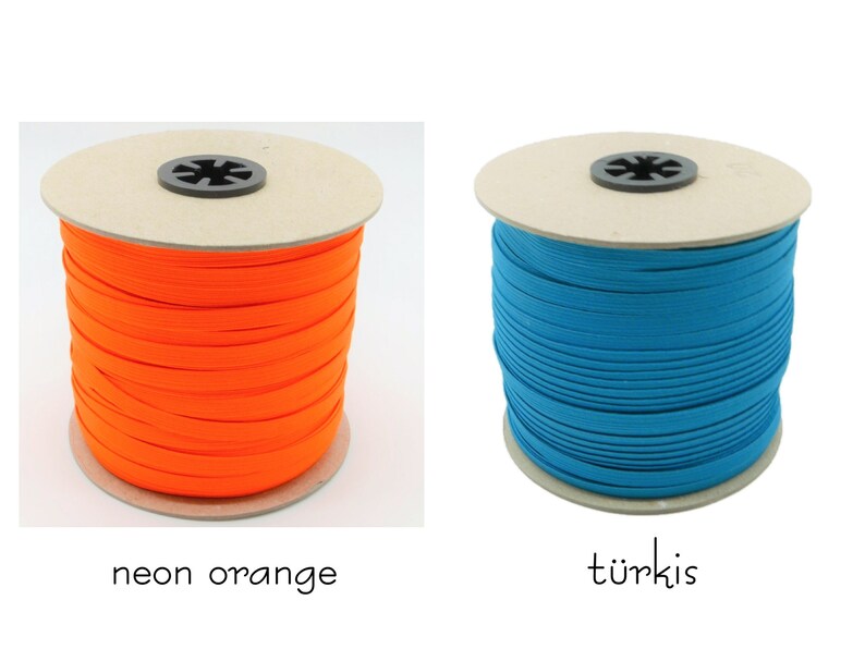 May include: Two spools of elastic cord, one neon orange and one turquoise.