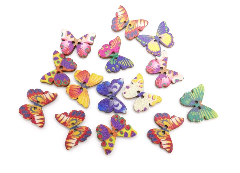 May include: Assortment of colorful wooden butterfly buttons with painted designs. The buttons have two holes each and are perfect for crafting projects.