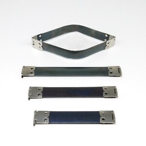 May include: Three metal straps with silver clasps. The top strap is bent into a diamond shape. The middle strap is dark green. The bottom strap is dark blue.