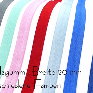 Könnte beinhalten: Sortiment aus 20 mm breitem Falzgummi in verschiedenen Farben, darunter Grau, Mintgrün, Rosa, Rot, Hellblau, Königsblau und Dunkelblau.