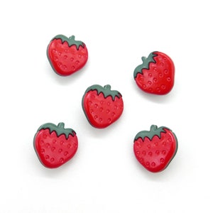 2 children&#39;s buttons made of plastic strawberry