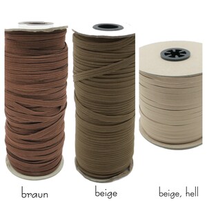May include: Three spools of elastic cord in brown, beige, and light beige. The spools are labeled "braun", "beige", and "beige, hell".