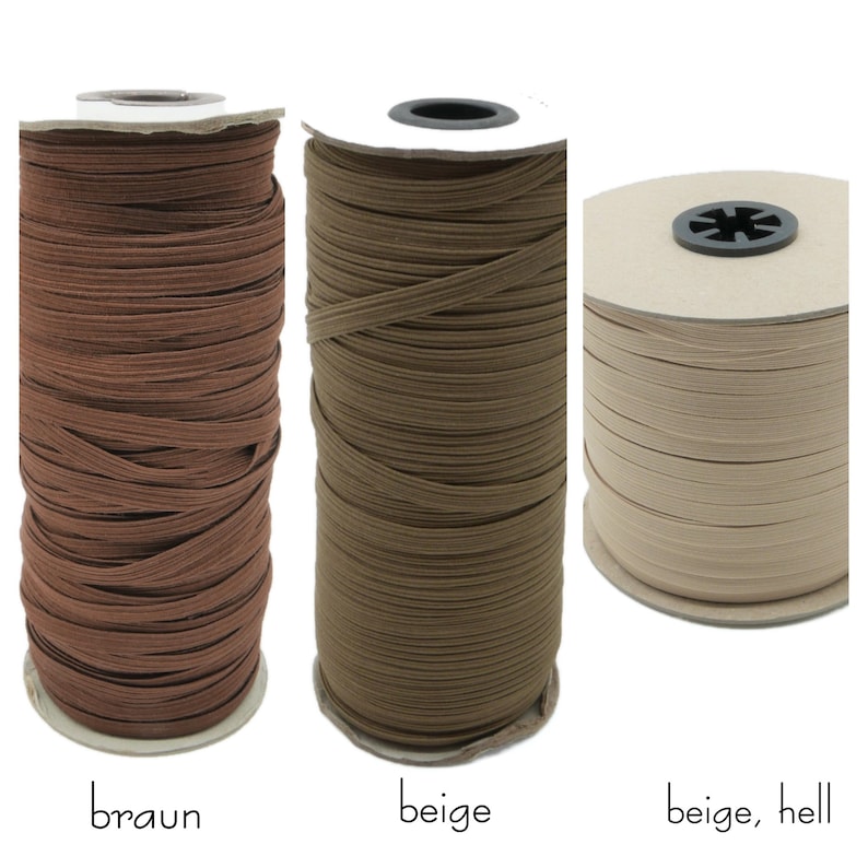 May include: Three spools of elastic cord in brown, beige, and light beige. The spools are labeled "braun", "beige", and "beige, hell".