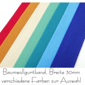 May include: A selection of cotton webbing in various colors, including red, orange, cream, teal, light blue, and dark blue. The webbing is 30mm wide and is labeled "Baumwollgurtband, Breite 30mm verschiedene Farben zur Auswahl".