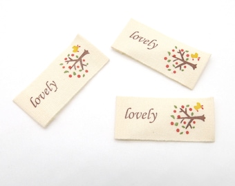 10 pieces, fabric label with lettering Lovely and tree