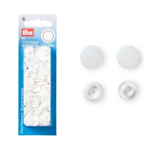 May include: A pack of 30 white plastic snap fasteners, also known as press fasteners or snap buttons. The pack includes both the male and female parts of the fasteners. The fasteners are 12 mm in diameter.
