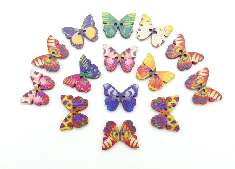May include: Assortment of 15 wooden butterfly buttons in various colors and patterns, including pink, purple, blue, green, yellow, and orange.